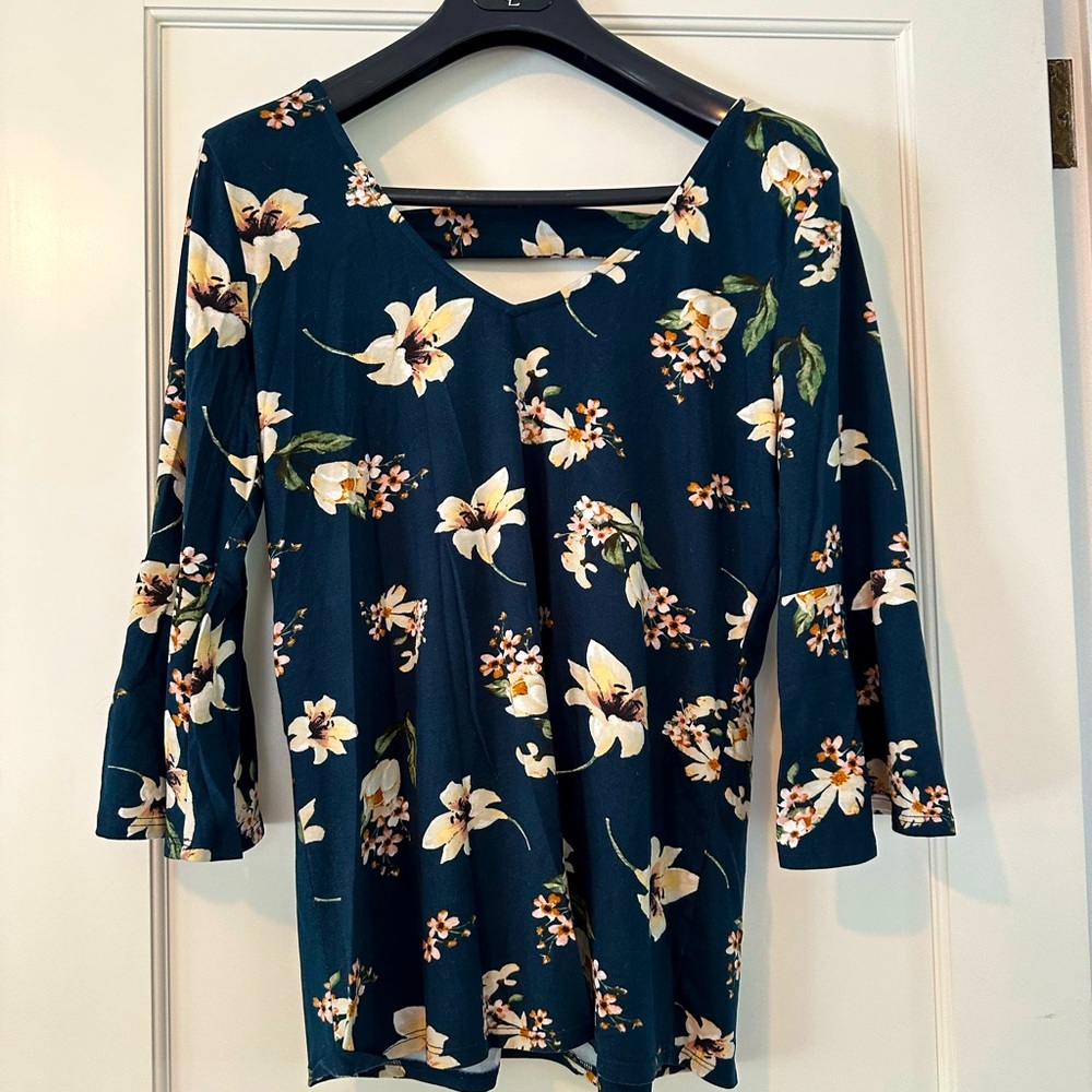 Dark teal blouse with trumpet sleeves